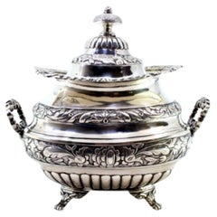 Silver sugar bowl w/ reliefs, applications, 2 handles, knobbed lid
4 claw feet