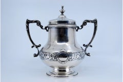 Silver sugar bowl with engravings surrounding a monogram card