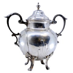 Silver sugar bowl with scrolls, applied handles 
four feet