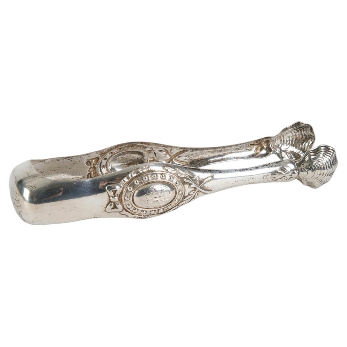 Pince à sucre en argent signée Louis Frédéric Guillaume Wolfers, seconde moitié du XIXe siècle. en vente