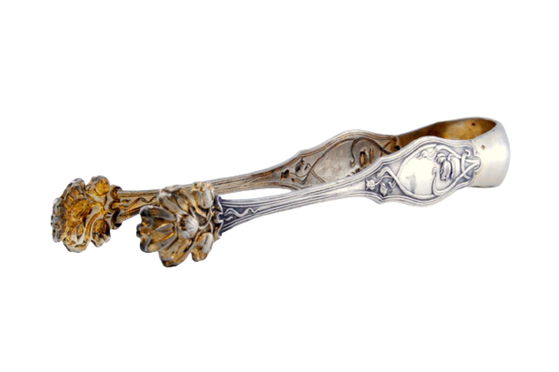 Silver sugar tongs in the shape of claws with raised floral motifs For Sale