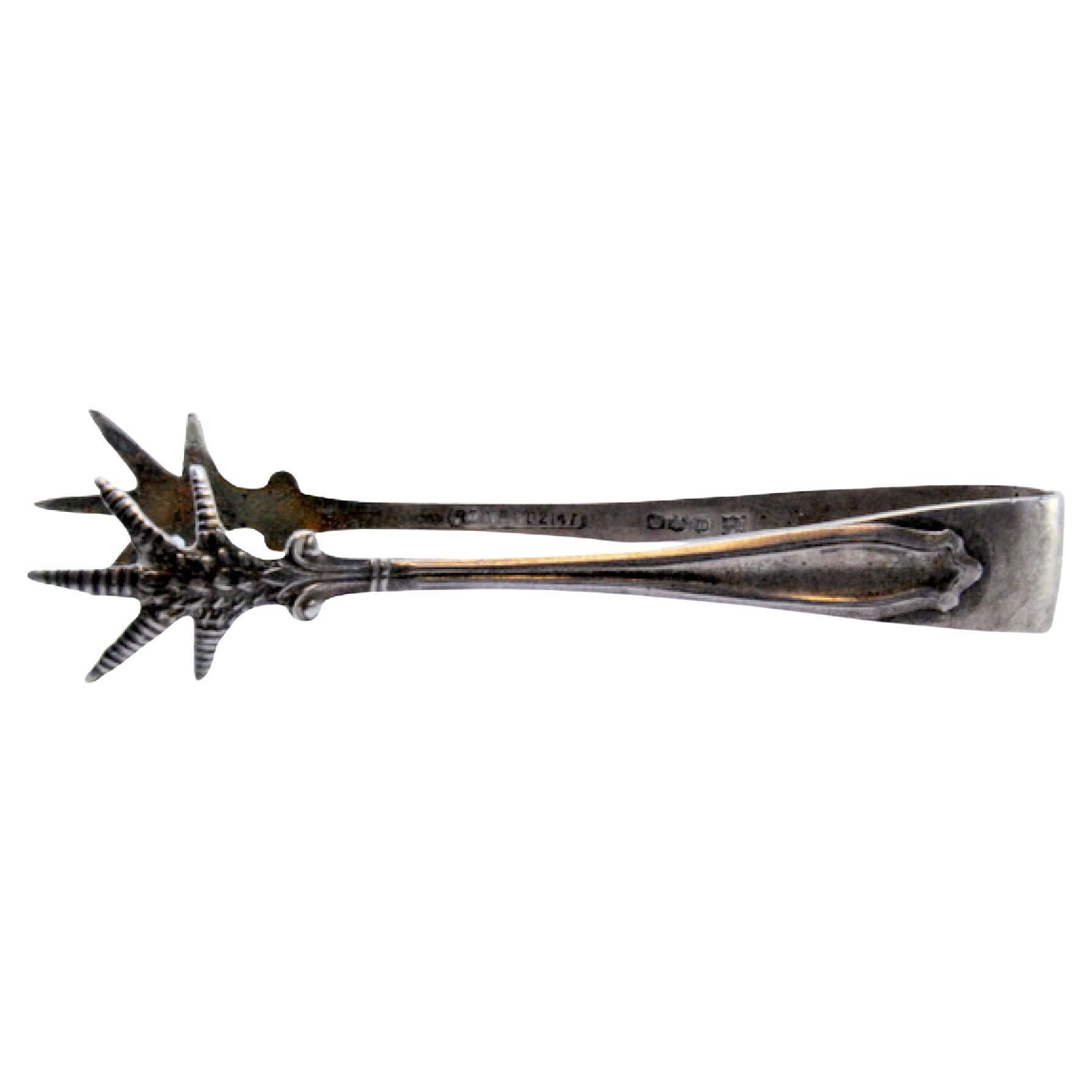 Silver sugar tongs with claw-shaped trim and tongs