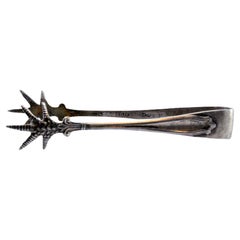 Silver sugar tongs with claw-shaped trim and tongs