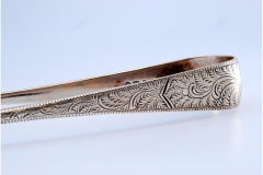 Silver sugar tongs with engraved plant motifs