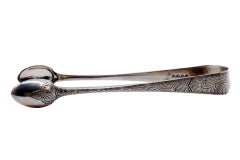 Silver sugar tongs with engraved plant motifs