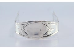 Silver sugar tongs with engraving on both sides