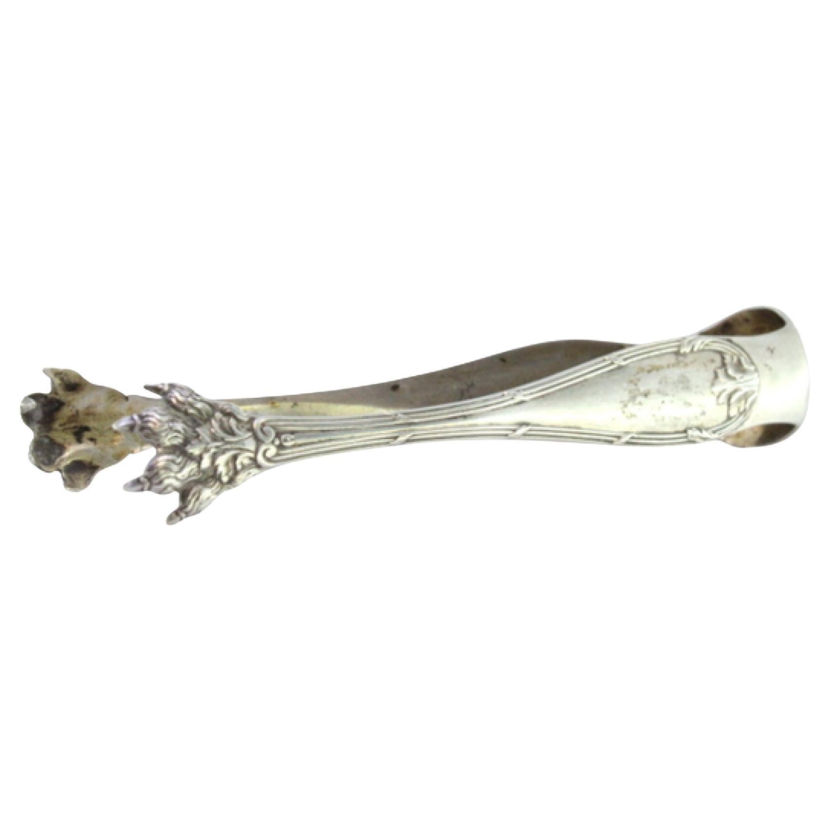 Silver sugar tongs with floral reliefs, friezes and claw-shaped tongs