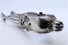Silver sugar tongs with fluted reliefs and applications
