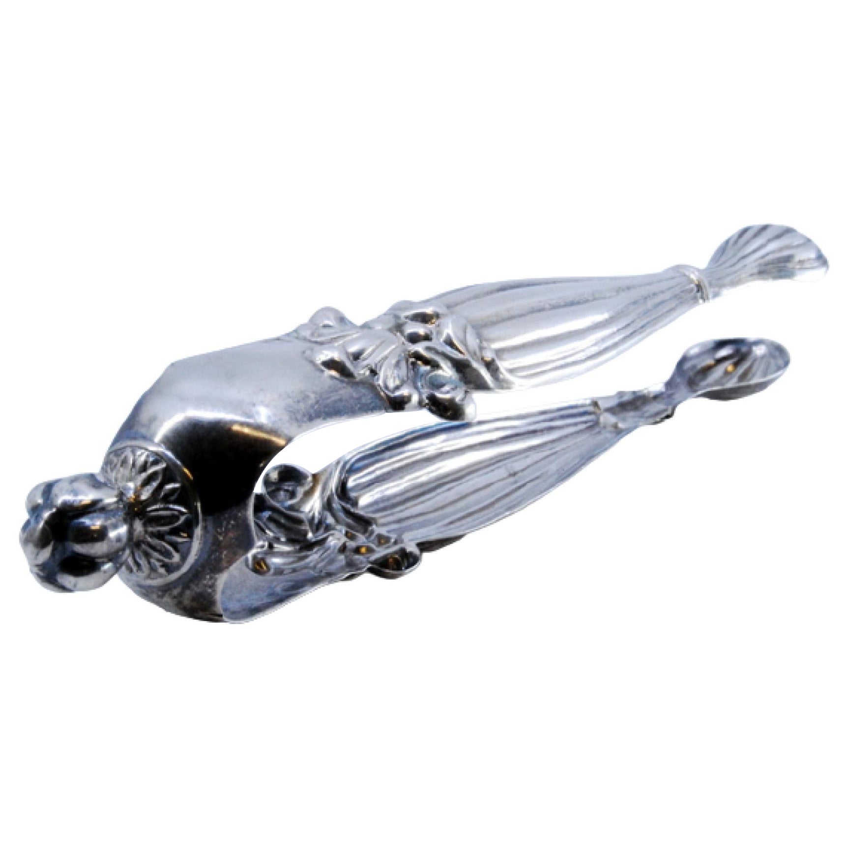 Silver sugar tongs with fluted reliefs and applications