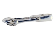 Silver sugar tongs with palms and shells