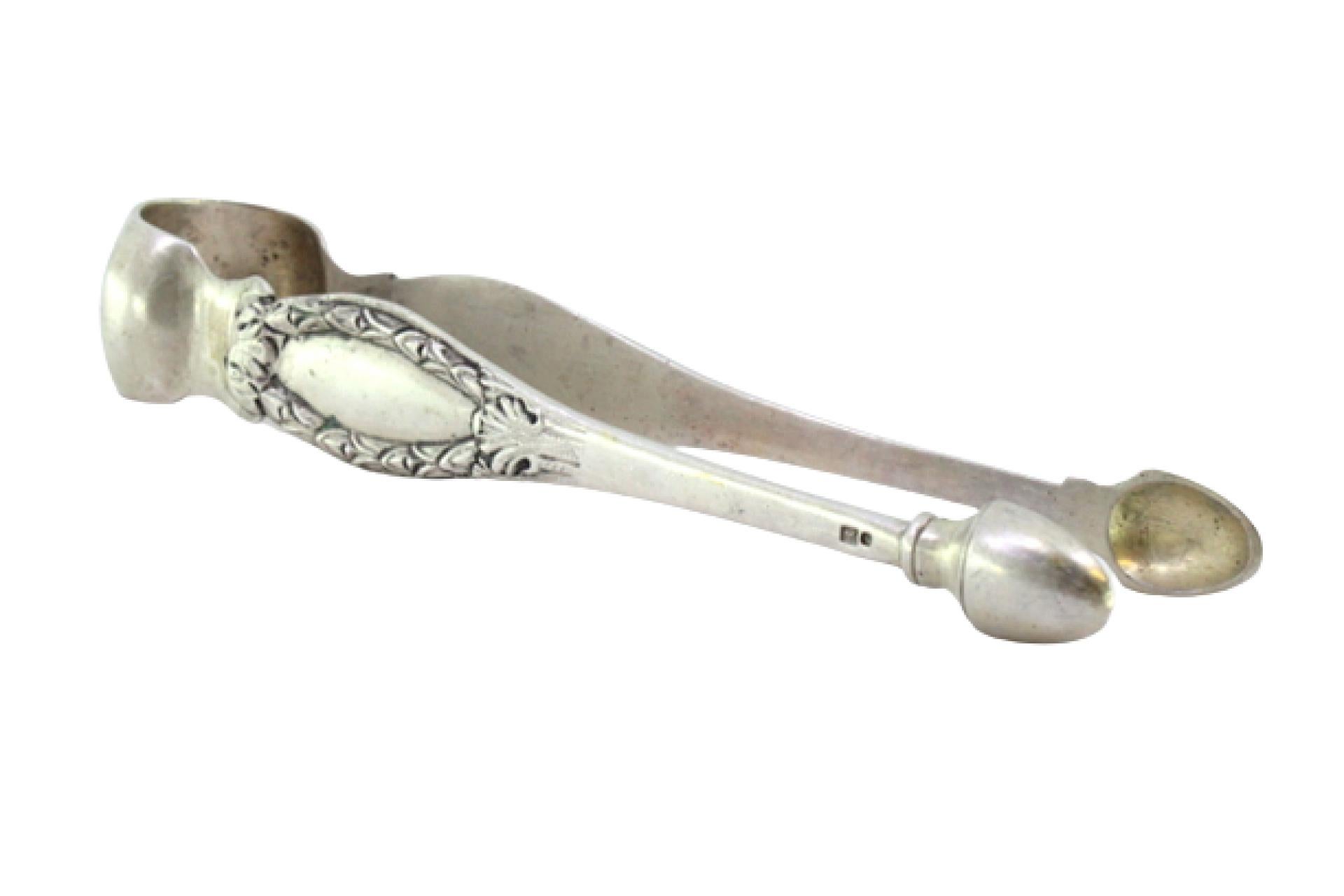 Silver sugar tongs with reliefs and monogram cards For Sale