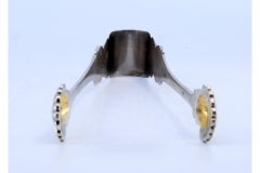 Silver sugar tongs with reliefs and scallop shells