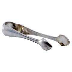 Silver sugar tongs with trim