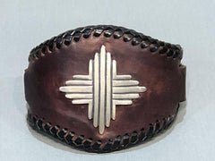 Silver Sun, leather cuff, sterling silver, brown, black, cast silver, Santa Fe