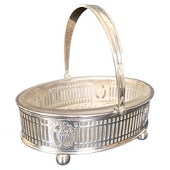 silver swing handled oval basket, glass liner, 1935