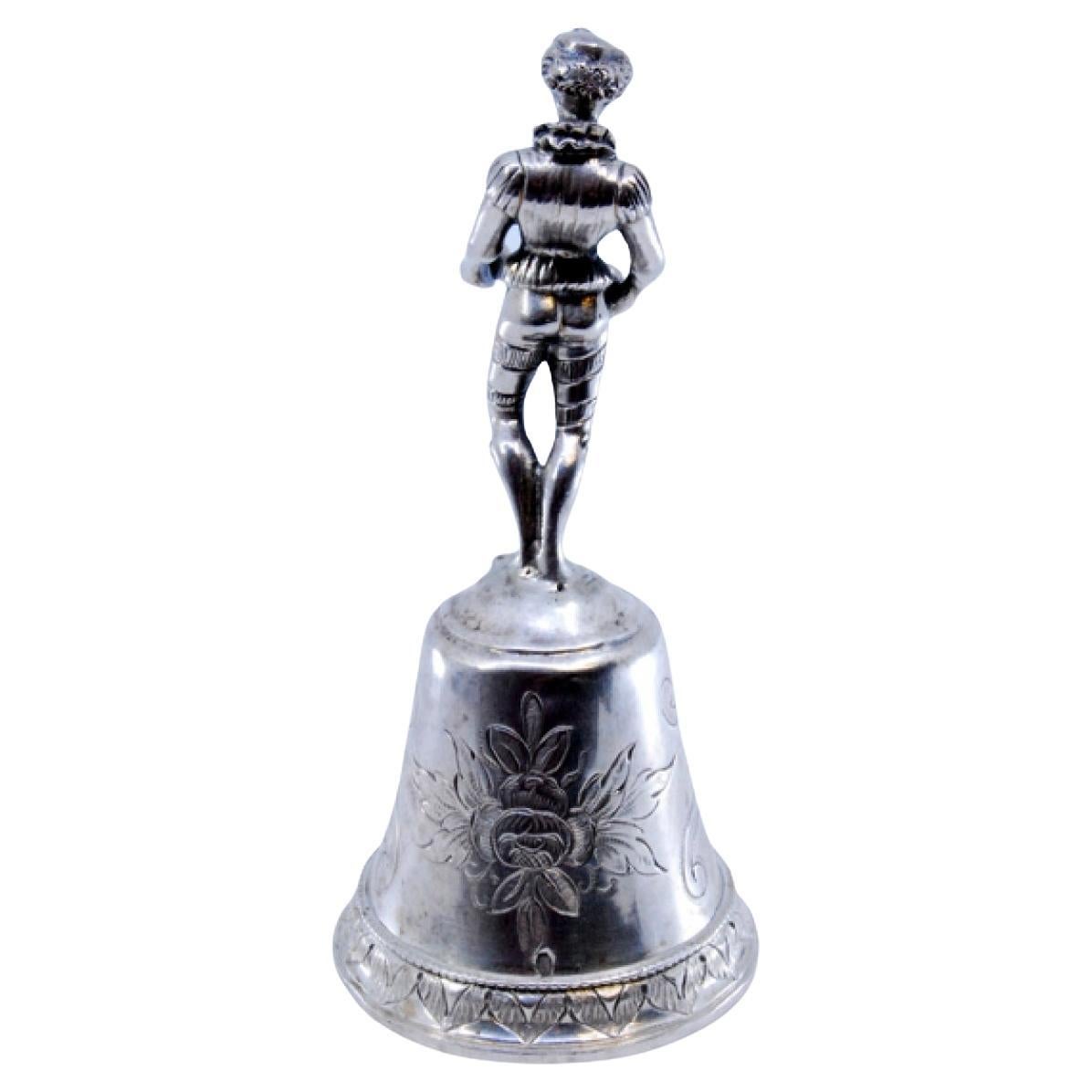 Silver table bell with reliefs and harlequin figure For Sale