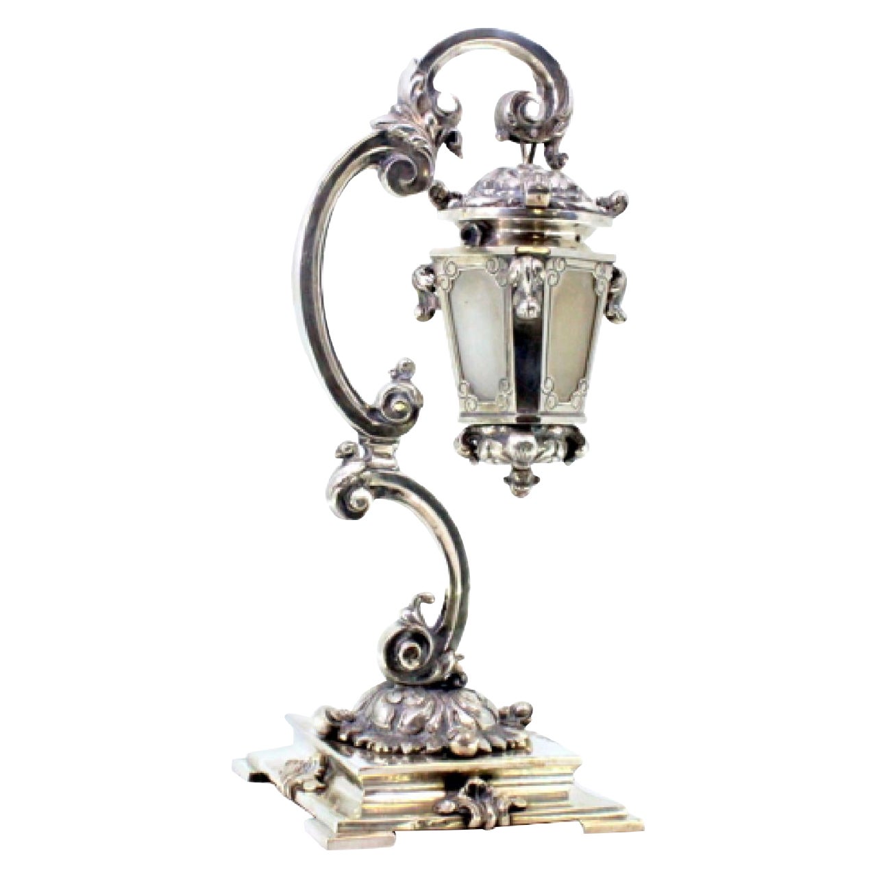 Silver table lamp suspended on relief structure with raised base, electrified