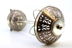 Silver table lamp with floral reliefs on circular base and acanthus feet