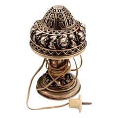 Silver table lamp with scalloped and embossed floral reliefs