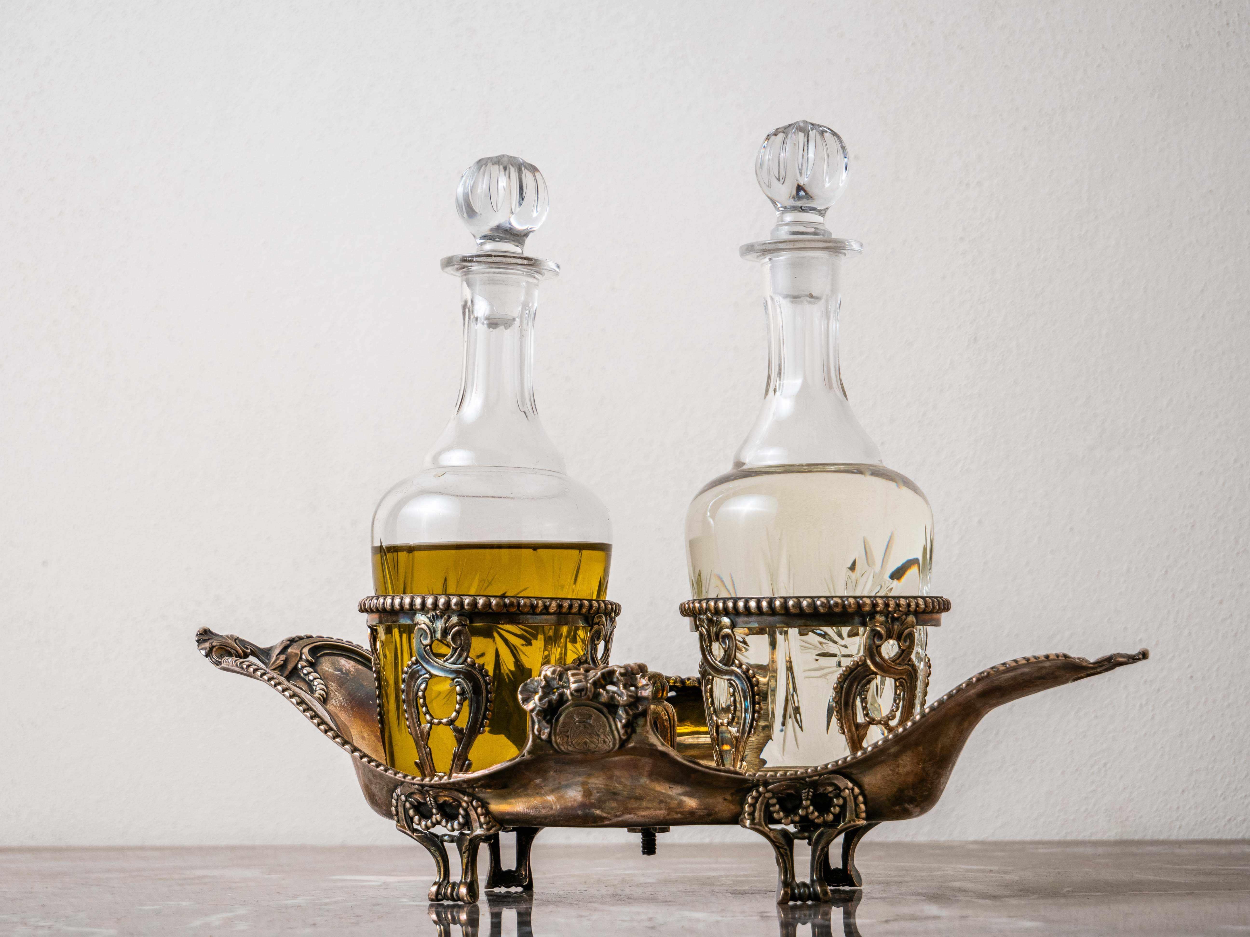 Silver table oil and vinegar set with coat of arms

Material: High-quality silver with purity 800 - marked with the Antwerp hallmark. This set is marked with a monogram and coat of arms.

Use: For oil and vinegar

This silver oil and vinegar table