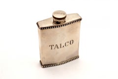 Silver talcum powder bottle with pearly edges