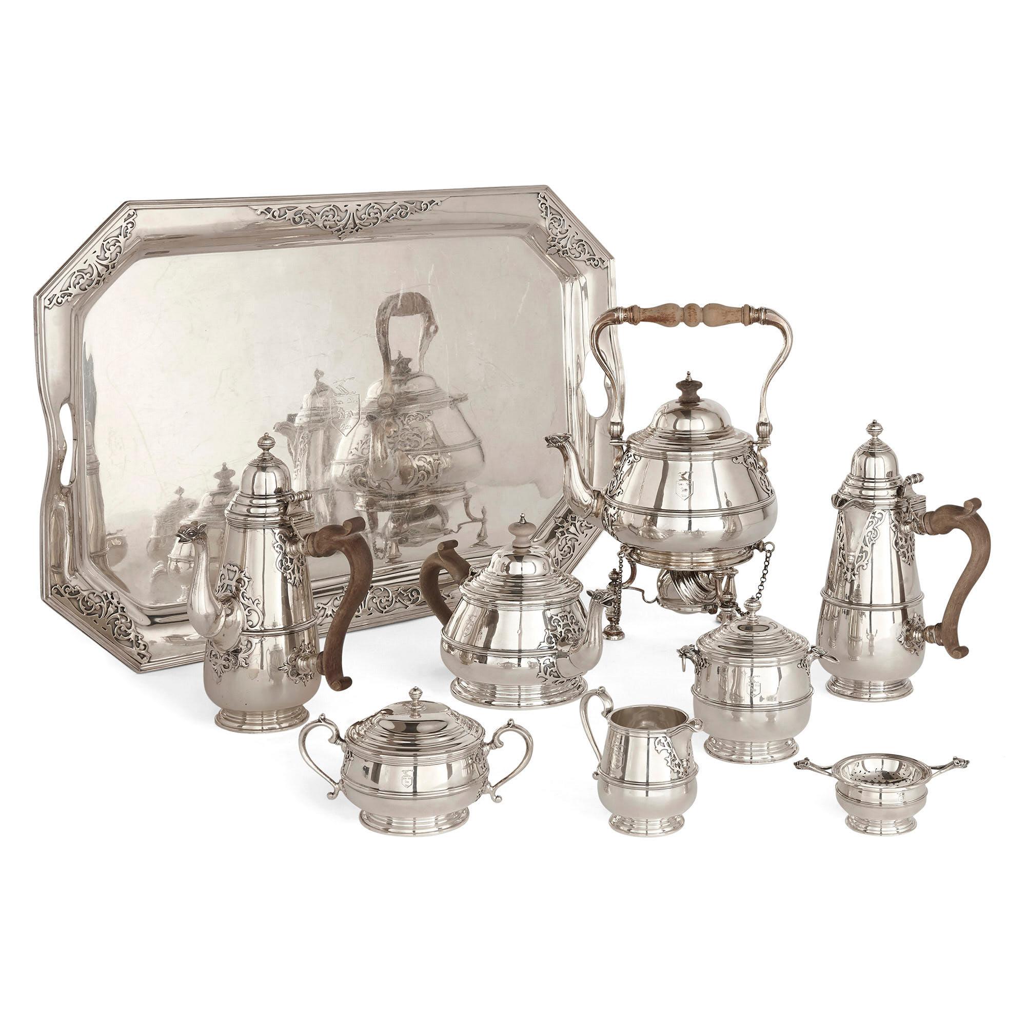 Silver tea and coffee set with matching tray
English, 1920-1921
Kettle on lampstand: Height 33cm, width 23cm, depth 16cm
Tray: Height 3cm, width 64cm, depth 44cm

This large silver set is comprised of a coffee pot, a tea pot, a kettle, a