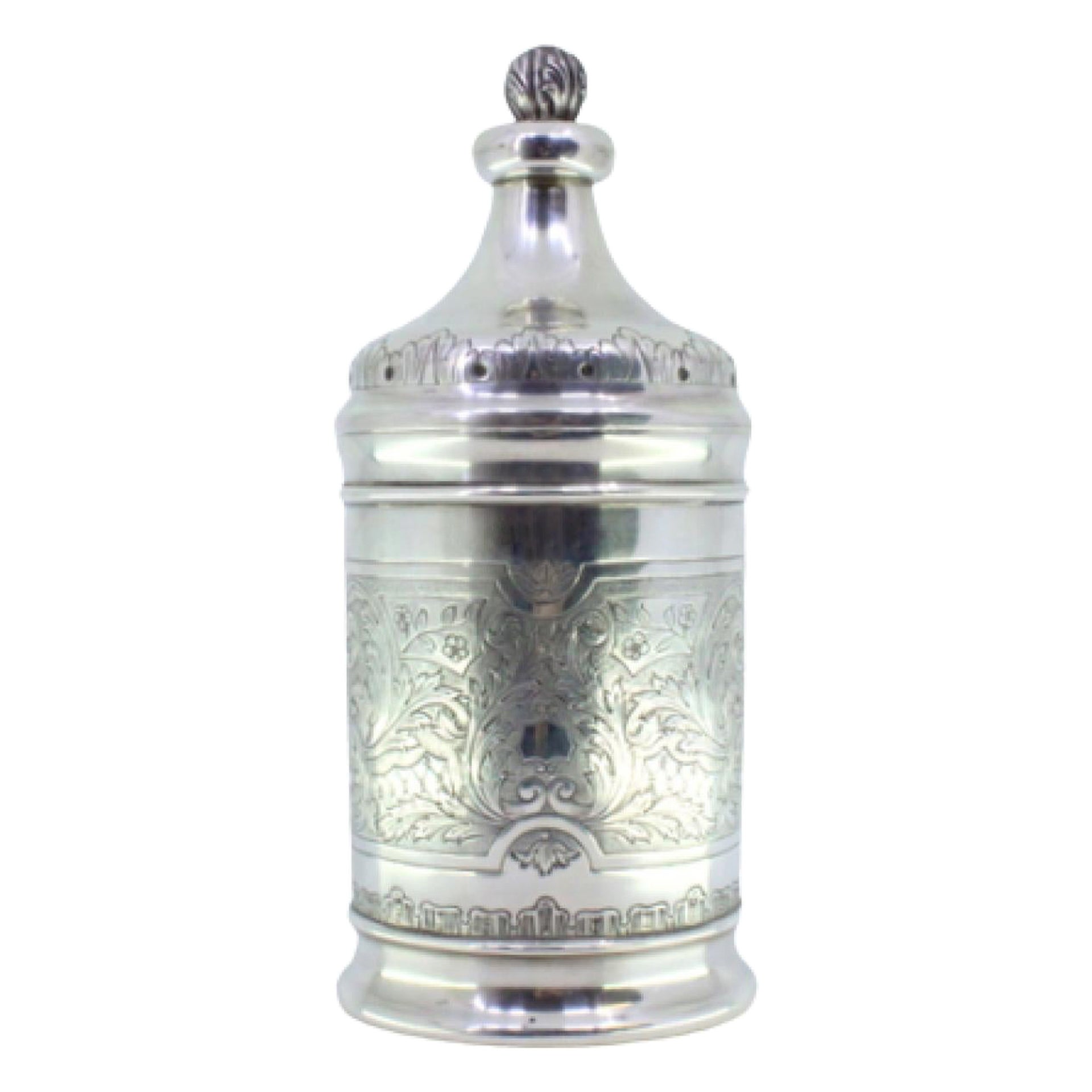 Silver tea box with engraved plant motifs and a flower-shaped knob on the lid