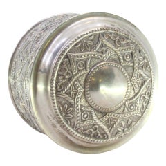 Silver tea box with floral reliefs and central monogram