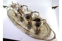 Silver tea & coffee service with kettle, tray & relief cutouts