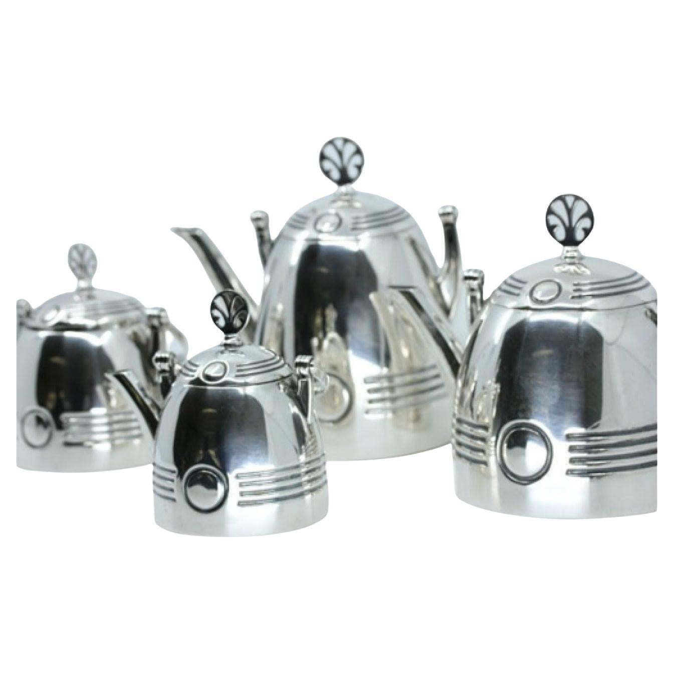 Silver tea service with teapot, milk jug, coffee pot 
sugar bowl For Sale