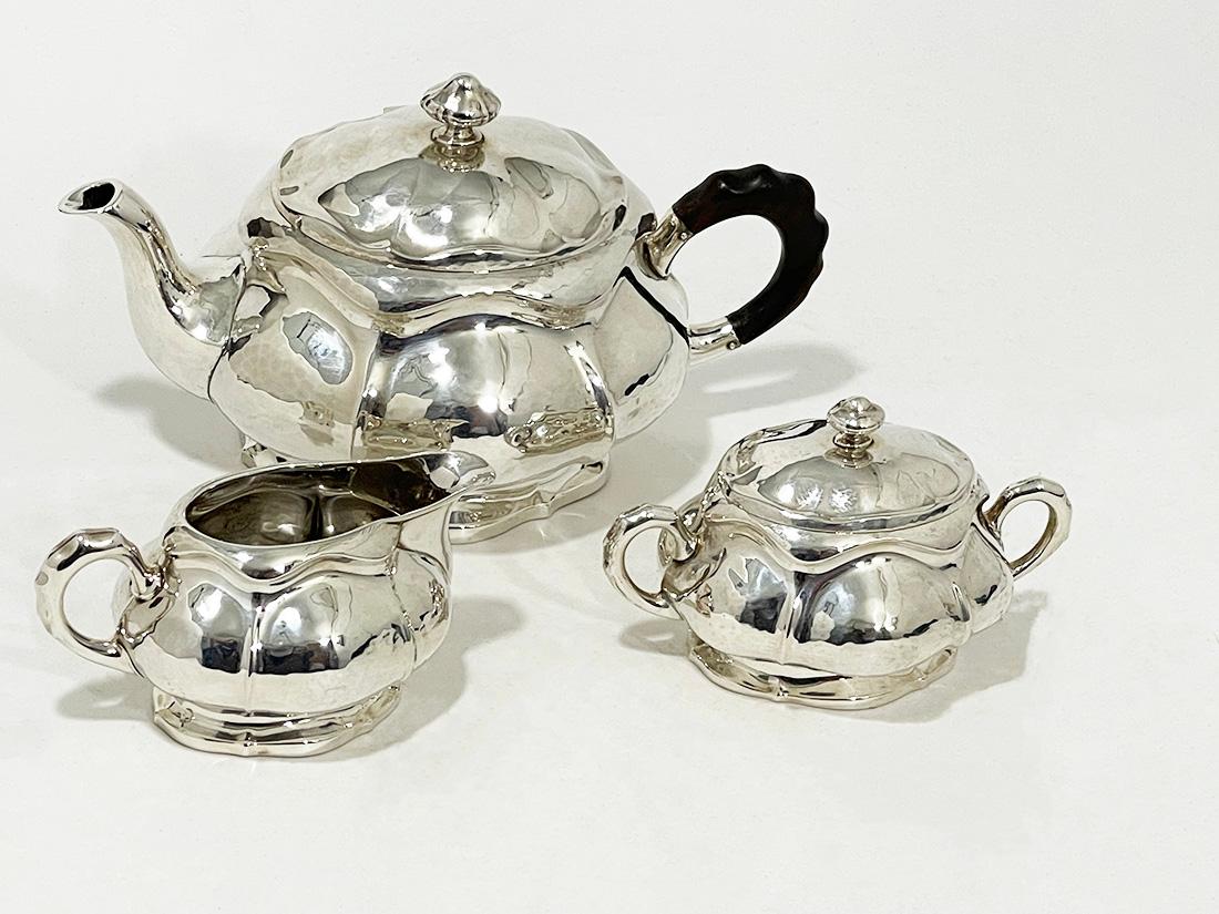 Silver tea set, ca 1900

A silver tea set with a teapot, sugar bowl and a milk jug in an oval shape with a scalloped pattern and is lightly hammered. Very elegant. It is silver marked 830S, which suggests that it is Scandinavian silver (Norway).

In