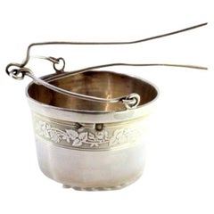 Silver tea strainer with engraving and hinged handle