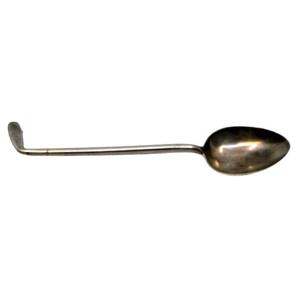 Silver teaspoon shaped like a golf club handle