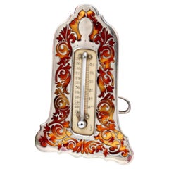 Silver thermometer with reliefs, table stand and hanging ring