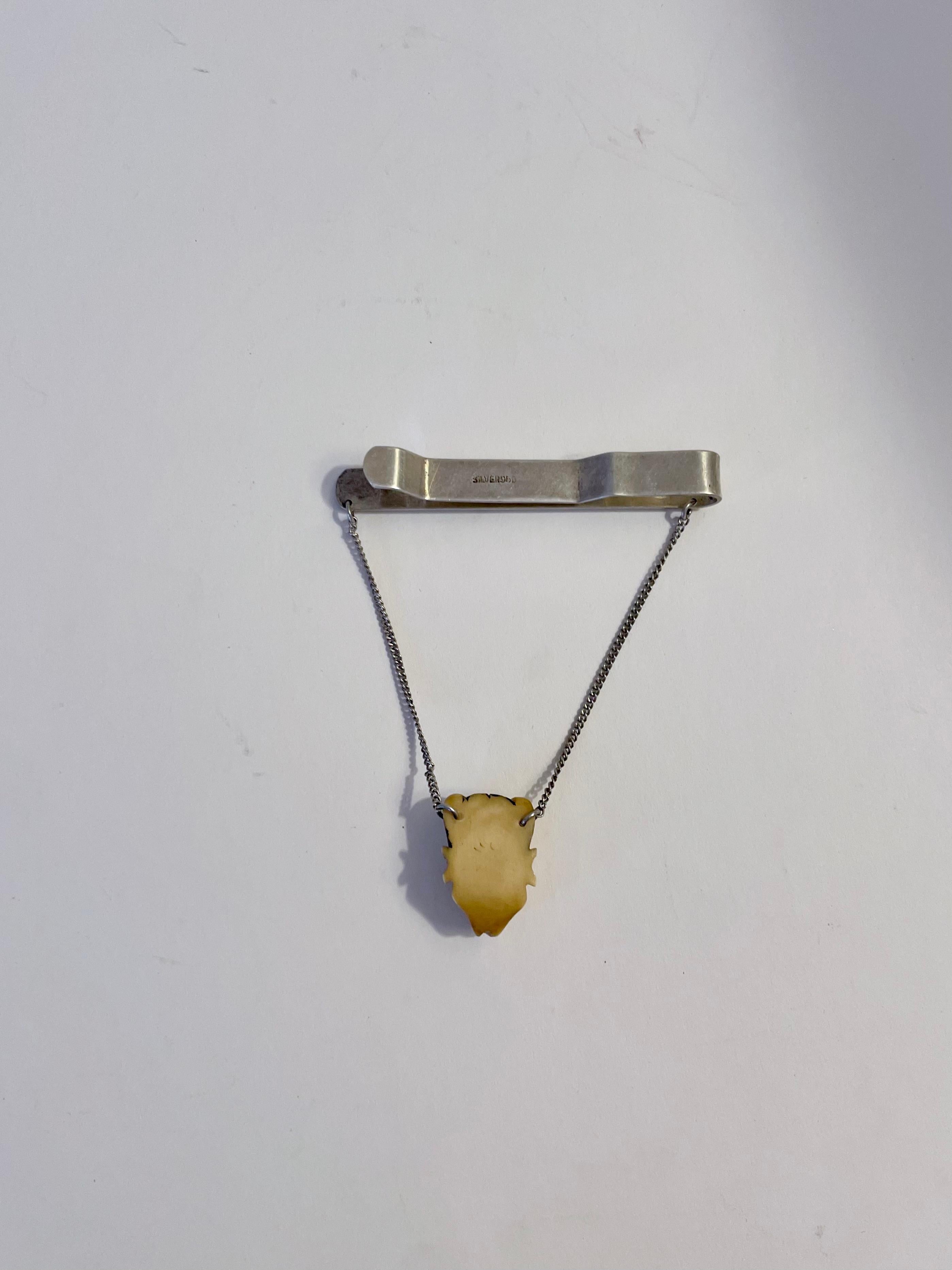 20th Century Silver Tie Bar with Horned Figure Detail of Bone For Sale