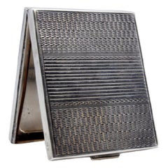 Silver toiletry box with asymmetrical engraving on both sides