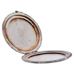 Silver toiletry box with beveled edges and mirrors inside