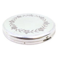 Silver toiletry box with floral engraved lid, mirror and guilloche base