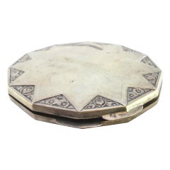 Silver toiletry box with floral reliefs, opening appliqué and mirror inside