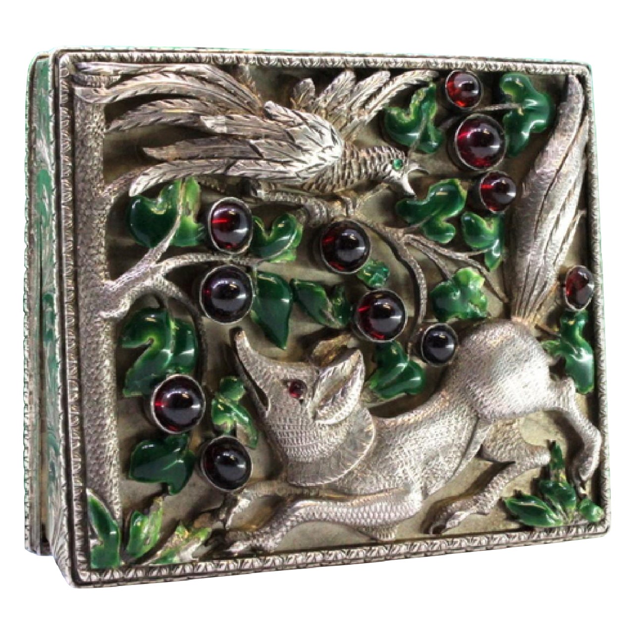 Silver toiletry box with fox-and-bird relief and enameled lid