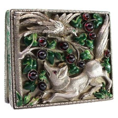 Silver toiletry box with fox-and-bird relief and enameled lid