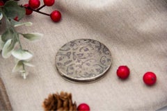 Silver toiletry box with garland-engraved lid and guilloche bands