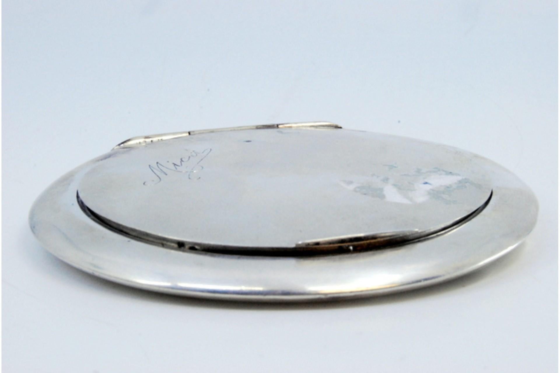 Description: Silver toiletry box with mirror inside and hinged lid. Metal: Silver. Origin: Portuguese. Brand: Cabeça de escravo. Weight: 138.87 grams. Dimensions: 9.8x9.8cm. Content: 833/1000. Assay Mark: Yes, between 1938 and 1984. Additional