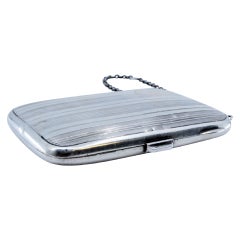 Silver toiletry box with mirror inside, tobacco container and utility chain