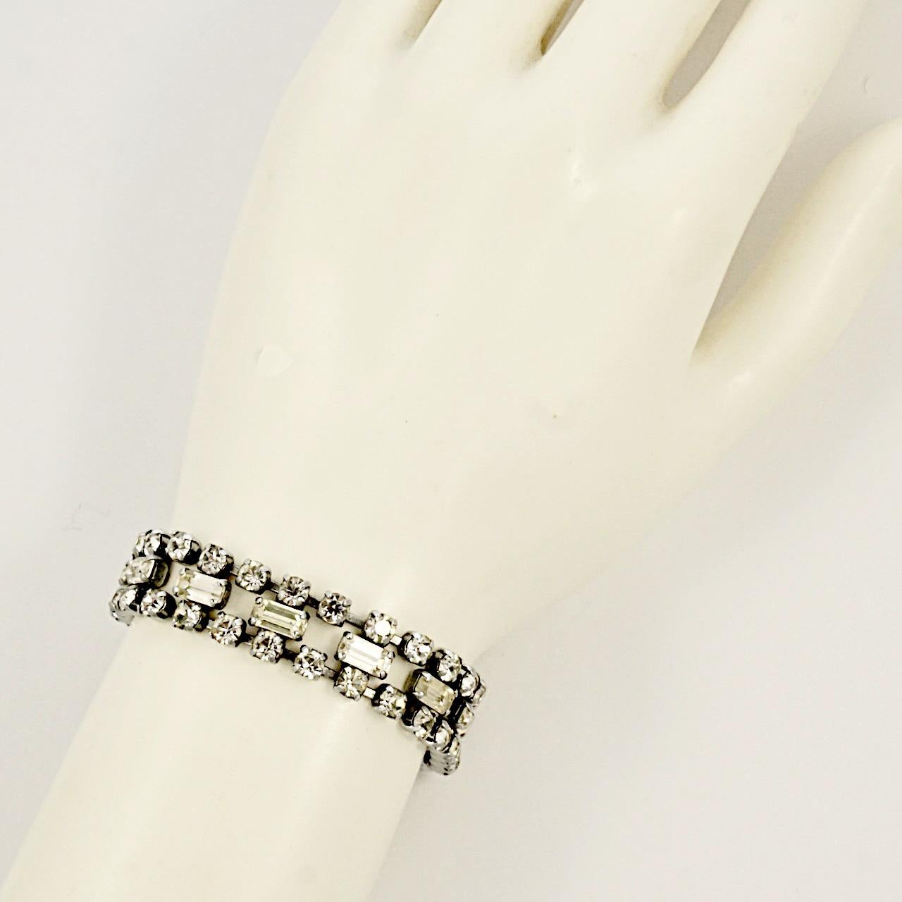 Fabulous silver tone bracelet, with sparkling baguette and round rhinestones. Measuring length 17.4 cm / 6.85 inches by width 1.2 cm / .47 inch. The bracelet is in very good condition.

This is a beautiful vintage bracelet for the evening or a