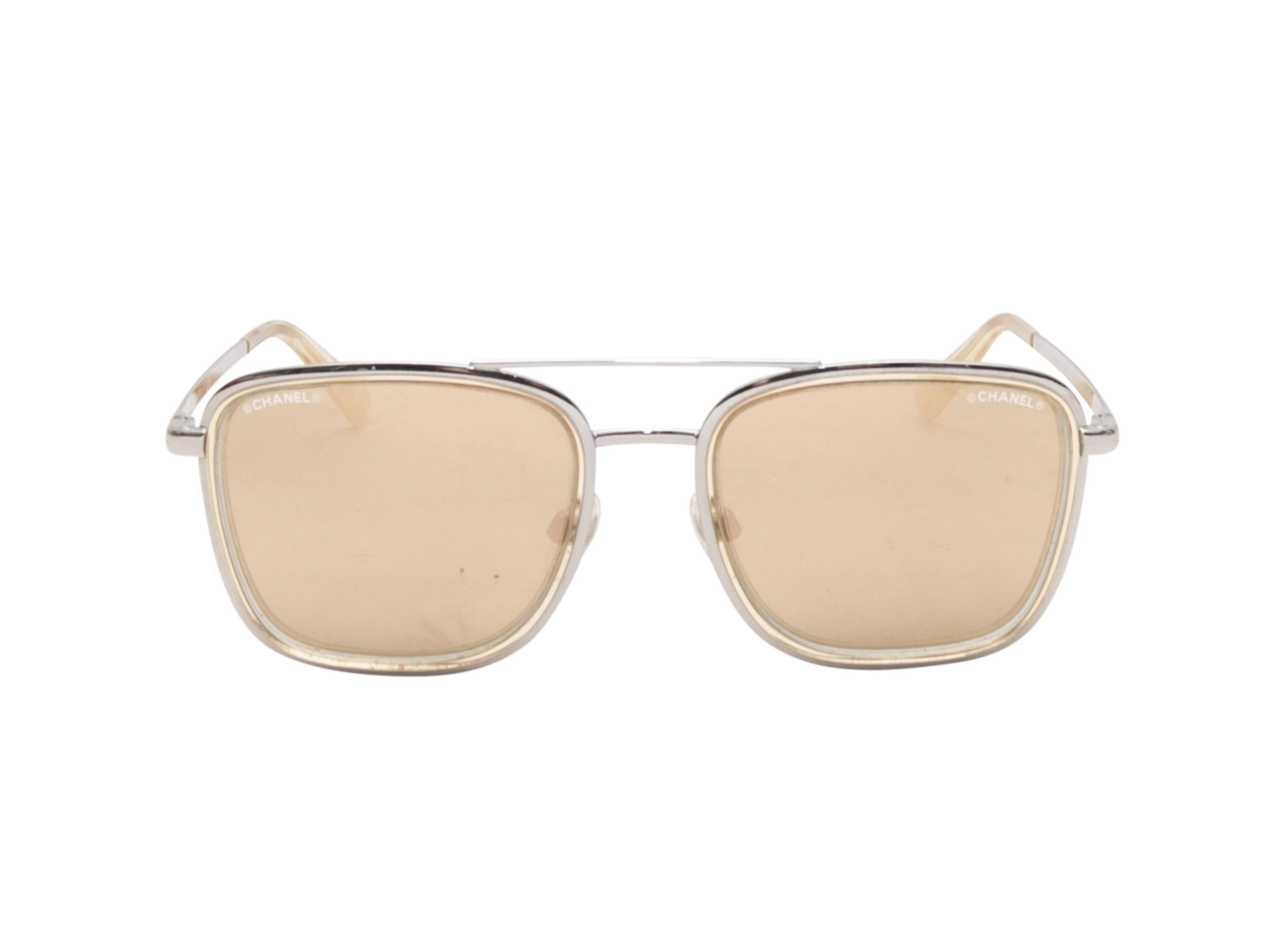 Silver-tone metal aviator sunglasses by Chanel. Brown tinted lenses. 1.75