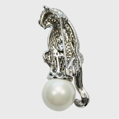 Silver Tone Pavé Panther Brooch with a Faux Pearl and Green Eyes