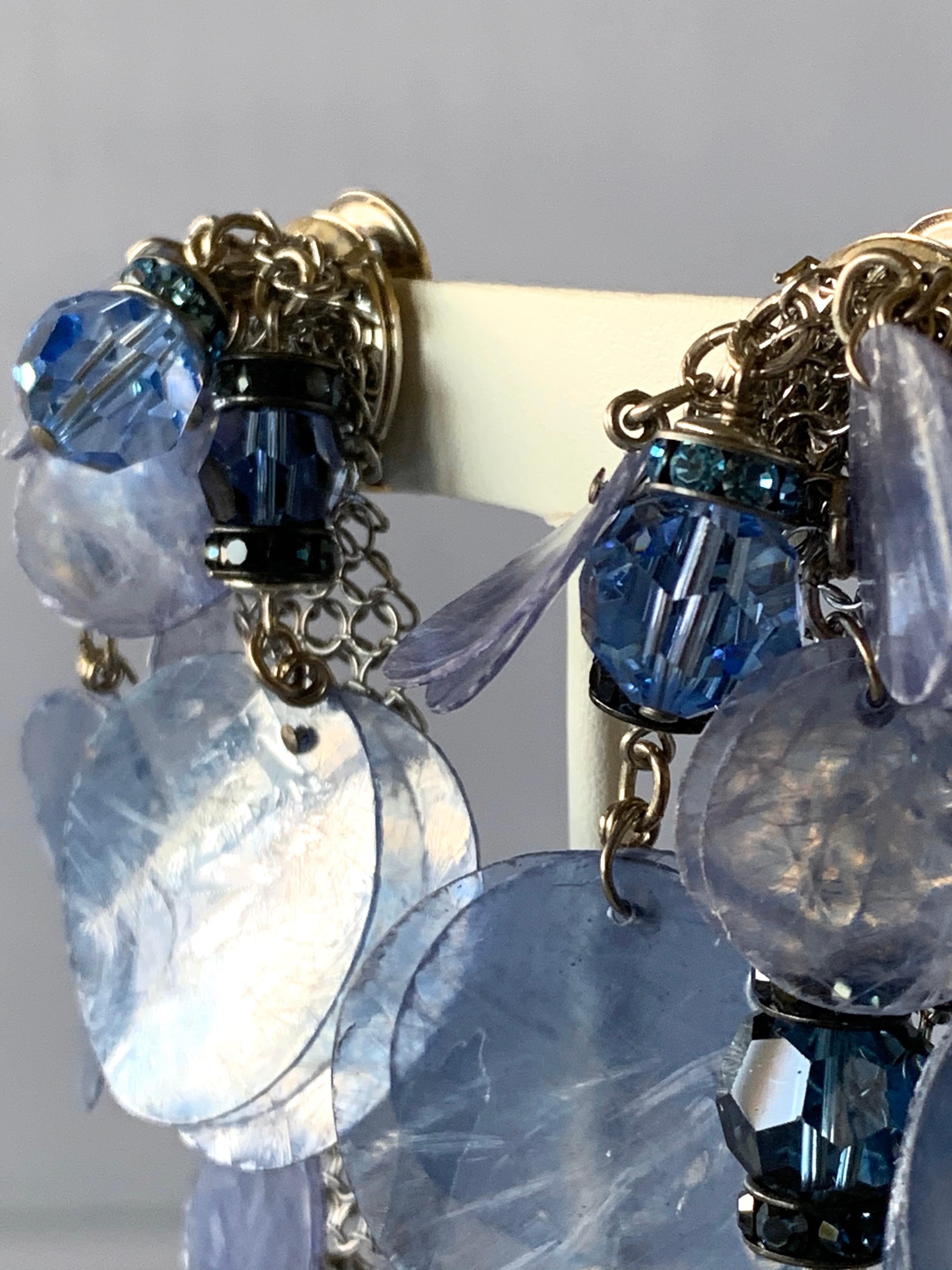 Contemporary silver-tone periwinkle blue fringe statement clip-on earrings - the earrings are comprised out of silver-tone and mesh which are adorned by periwinkle-blue piettes, rhinestones, and faceted glass ab beads. Made in France, by Francoise