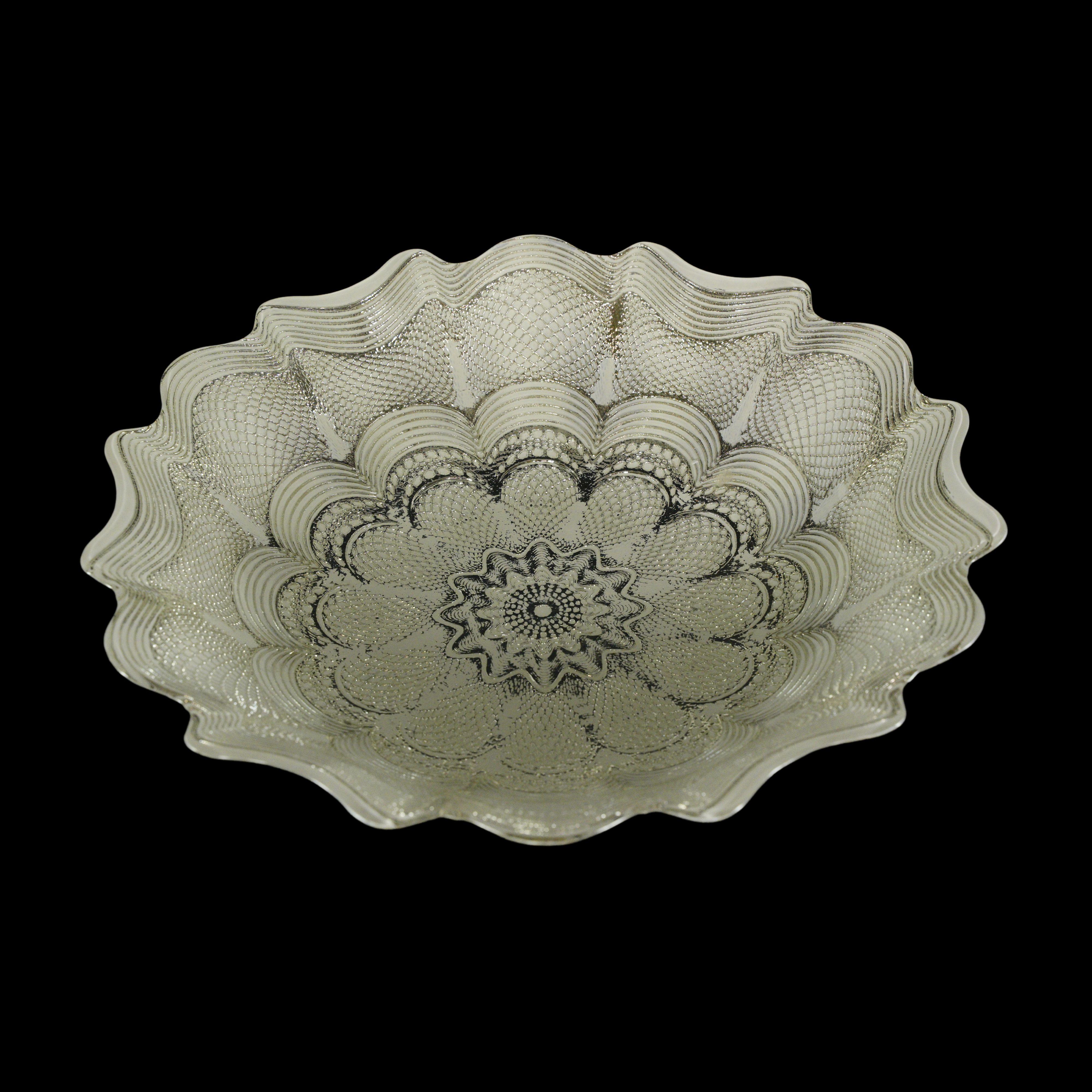 Clear and white glass bowl with silver tone finish backing. This delightful bowl features beautiful floral details. Acquired from an estate located in Greenwich, Connecticut. Good condition with surface wear from prior use. One available. Please