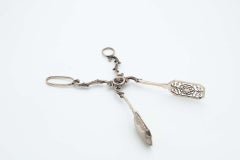 Silver tongs for bread or salad with cutouts